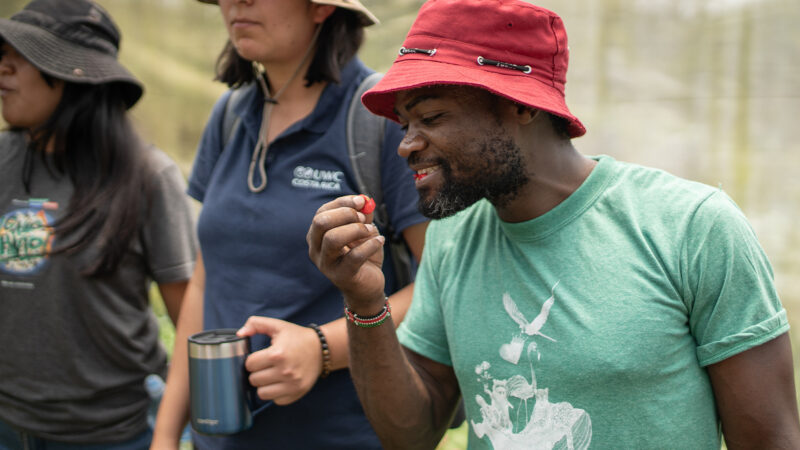 UWC Costa Rica educator eating an edible flower